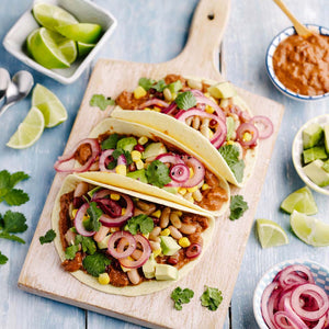 Bean Tacos with mole sauce and pink onions
